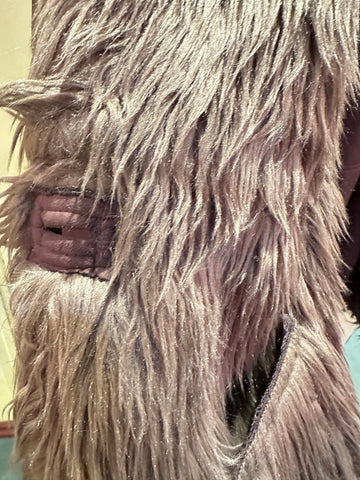 Close-up of the fur collar and leather details of the Novelti Long Coat, showcasing its luxurious texture.