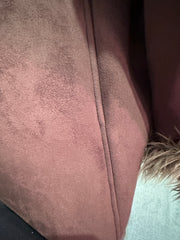 Close-up of the luxurious fabric and stitching detail of the Novelti Long Coat, showcasing its rich brown color and texture.