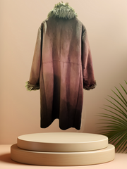 Back view of Novelti Long Coat with fur collar, showcasing a stylish design on a display pedestal.