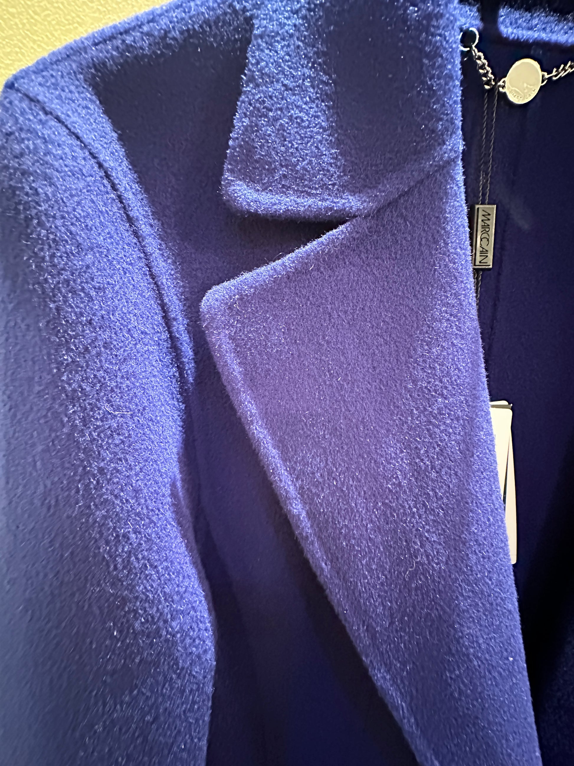 Close-up of Marccain royal blue long coat showcasing the soft wool texture and stylish collar design.