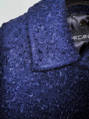 Close-up of Marccain textured blue fabric coat, showcasing design detailing and stylish collar, ideal for winter fashion.
