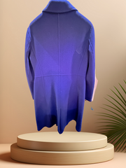 Back view of a Marccain royal blue long coat, made from 100% premium wool, displayed on a pedestal.