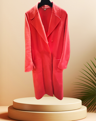 Marccain Coral Red Long Coat made of wool and cashmere, displayed elegantly with a modern backdrop.