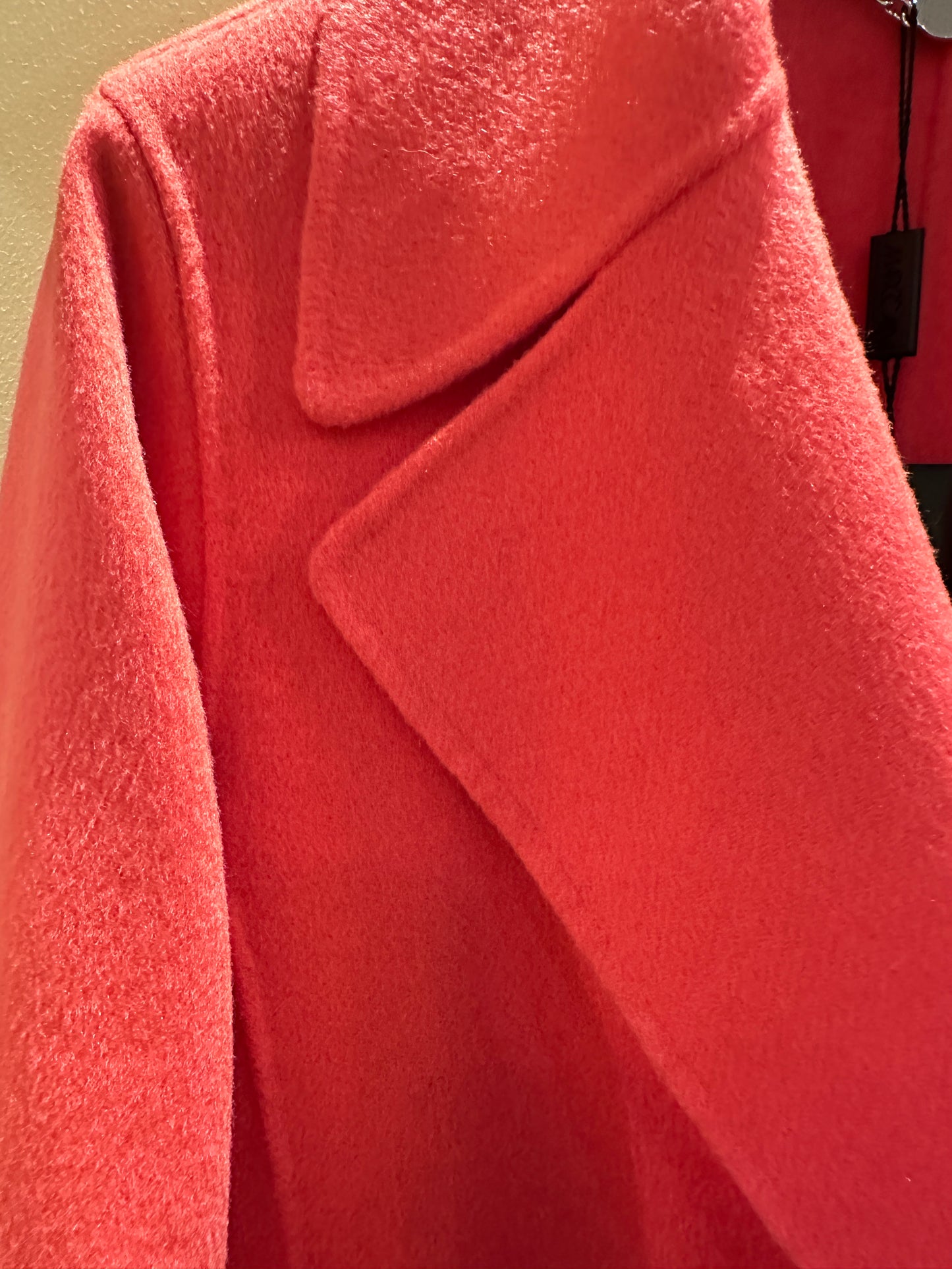 Marccain coral red long coat featuring wool and cashmere blend for warmth and comfort, stylish collar detail.