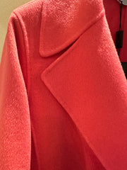 Marccain coral red long coat featuring wool and cashmere blend for warmth and comfort, stylish collar detail.