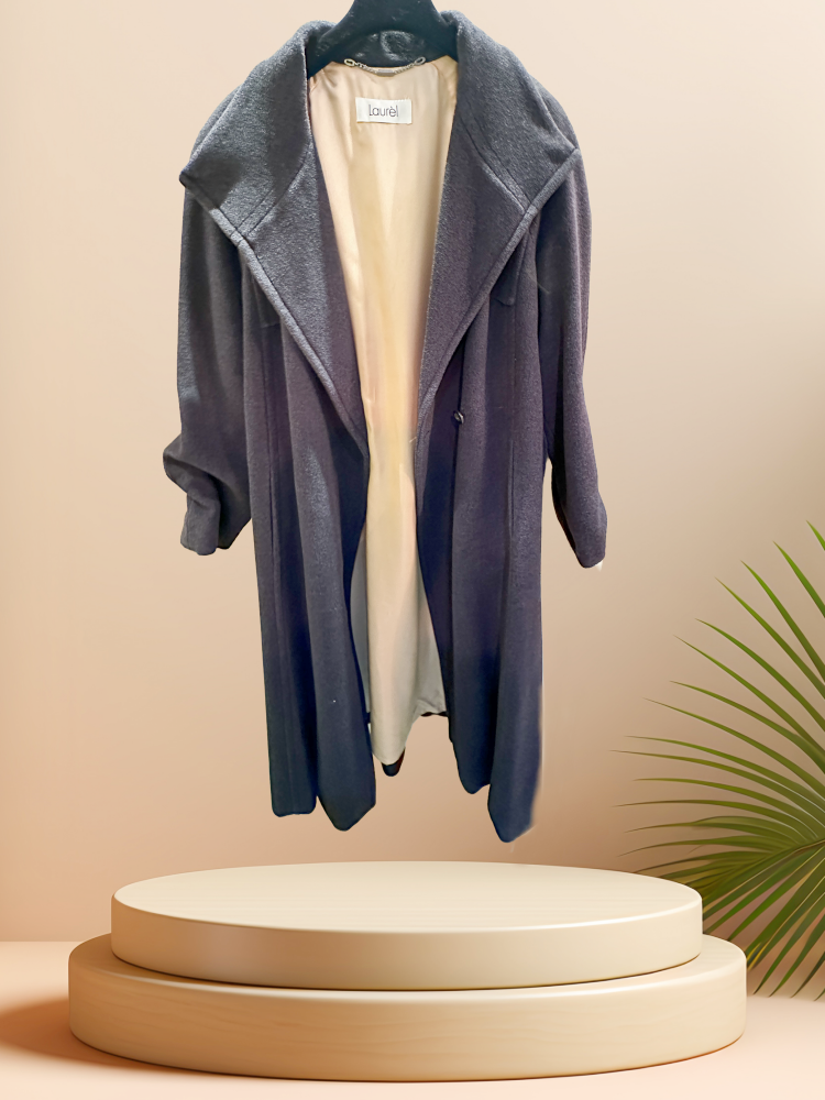 Laurel Gray Long Coat displayed on a podium, showcasing its elegant design and lightweight fabric.