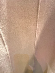 Close-up view of the luxurious fabric of the Marccain Wheat Long Coat, showcasing its soft texture and warmth.