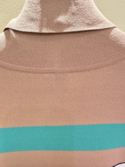 Back view of Marccain turtle neck blouse showing soft fabric and unique color stripes.
