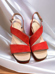 Marccain suede sandals with chunky heels in vibrant orange, perfect for stylish comfort and versatility.