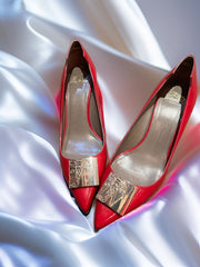 Versace Red Kitten Heel showcasing a stunning red and gold design on a satin surface, perfect for elevating your style.