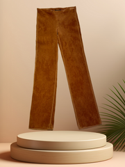 Marccain brown corduroy straight pants displayed on a pedestal, showcasing a stylish and polished look.
