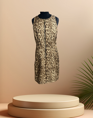 Michael Kors leopard print dress displayed on a pedestal, showcasing its bold design and high-quality fabric.