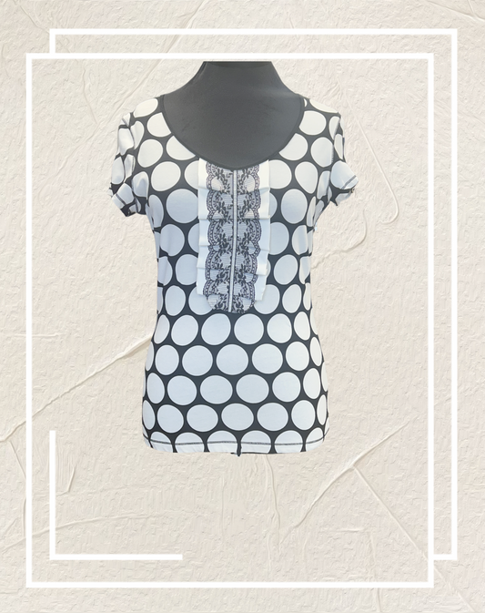 Ambiente B&W Polka Dot Blouse featuring a chic polka dot pattern, comfortable cotton blend, stylish short sleeves.