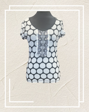 Ambiente B&W Polka Dot Blouse featuring a chic polka dot pattern, comfortable cotton blend, stylish short sleeves.