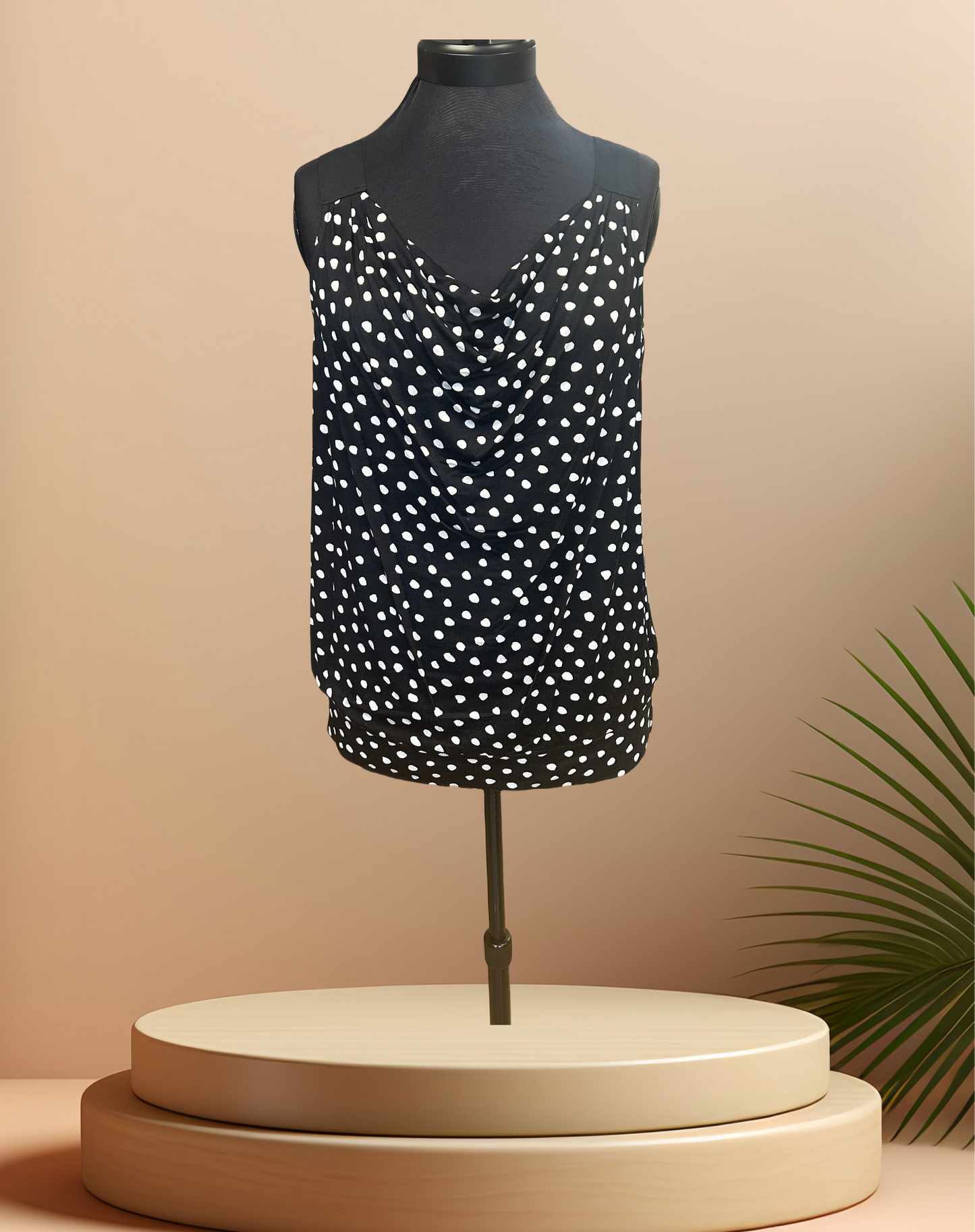 Michael Kors black polka dot blouse displayed on a mannequin, perfect for summer casual outfits.