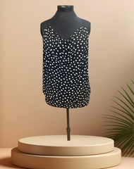 Michael Kors black polka dot blouse displayed on a mannequin, perfect for summer casual outfits.