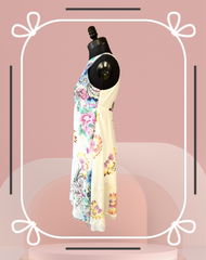 Versace Silk Lotus Flower Dress displayed on a mannequin, showcasing its elegant floral design and luxurious silk fabric.
