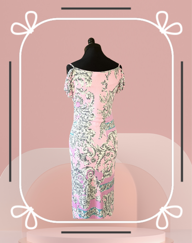 Versace pink summer dress showcasing a stylish design with intricate patterns, perfect for warm weather occasions.