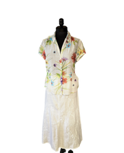 Gerard Darel long white linen skirt paired with a floral short-sleeve shirt, showcasing summer style and comfort.