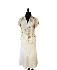 Gerard Darel long white linen skirt paired with a floral short-sleeve shirt, showcasing summer style and comfort.