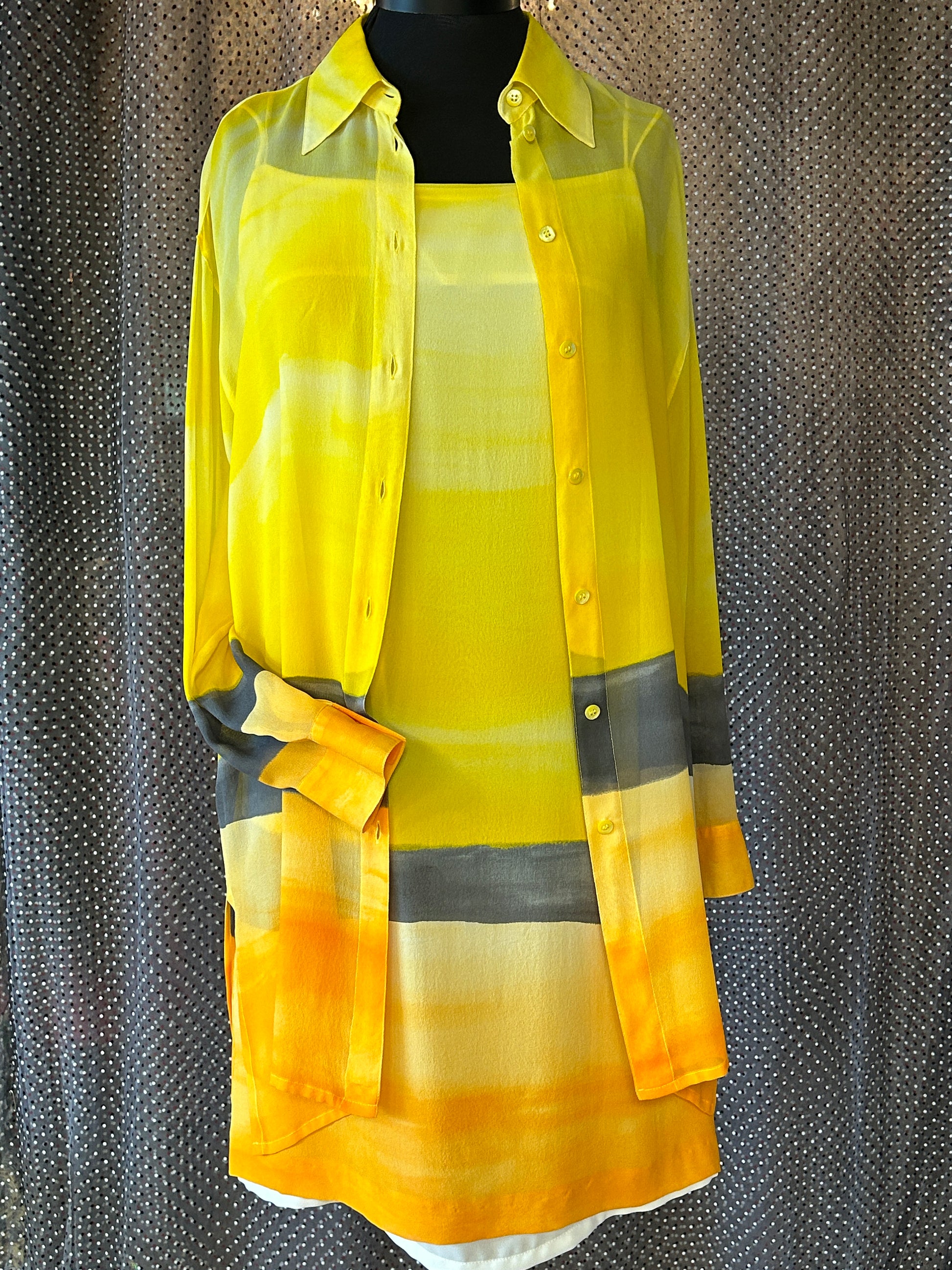 Laurel Silk Dress featuring a vibrant sunset gradient in yellow, paired with a matching long shirt for a stylish summer look.