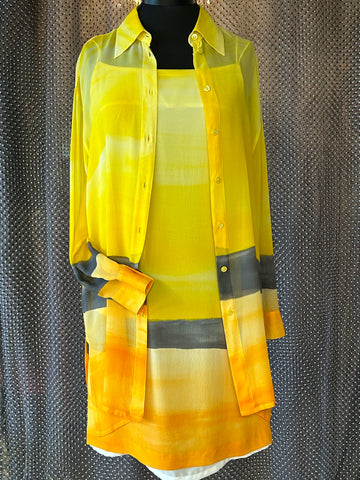 Laurel Silk Dress featuring a vibrant sunset gradient in yellow, paired with a matching long shirt for a stylish summer look.