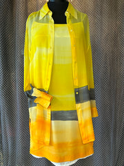 Laurel Silk Dress featuring a vibrant sunset gradient in yellow, paired with a matching long shirt for a stylish summer look.