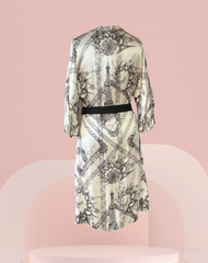 Back view of Jean's Paul Gaultier silk dress with Eiffel Tower print, featuring 3/4 sleeves and a black belt.