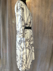 Side view of Jean's Paul Gaultier silk dress featuring Eiffel Tower design in black and white, with 3/4 length sleeves.