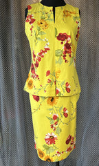 Derrico yellow floral blouse and matching skirt set, perfect for summer, featuring sleeveless design and elegant floral pattern.