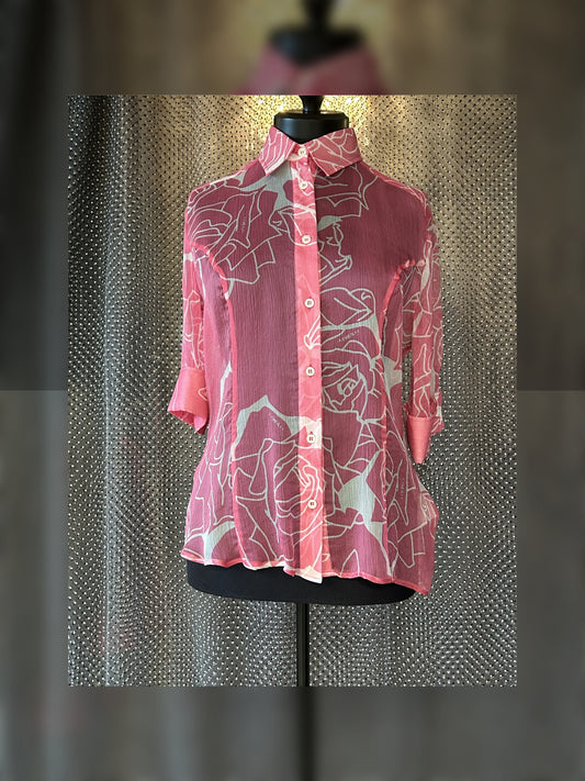 Versace silk shirt with floral pattern on display, perfect for summer styling, crafted from luxurious 100% silk.