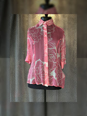 Versace silk shirt with floral pattern on display, perfect for summer styling, crafted from luxurious 100% silk.