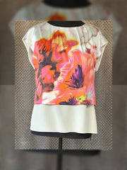 Marccain silk blouse with floral print in vibrant colors, featuring a luxurious and versatile design for any outfit.