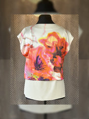 Marccain silk blouse featuring a floral print back and a soft, luxurious silk design. Perfect for elevating your wardrobe.