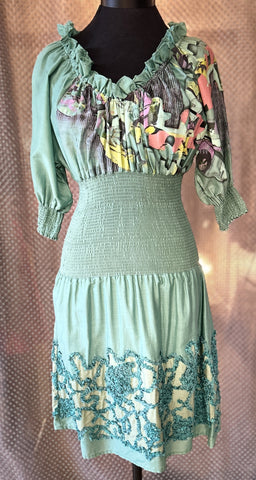 Save The Queen green dress featuring unique prints and elegant details, perfect for a stylish wardrobe upgrade.