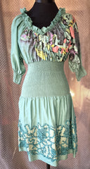 Save The Queen green dress featuring unique prints and elegant details, perfect for a stylish wardrobe upgrade.