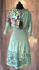 Save The Queen green dress featuring floral detailing, smocked waist, and elegant design perfect for a stylish wardrobe.