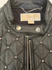 Close-up of the Michael Kors Leather Jacket featuring stylish silver nail decorations and quilted design.
