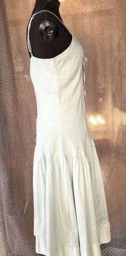 Essentiel Turquoise Summer Dress in 100% cotton, featuring a classic cut and flared skirt for casual comfort and style.