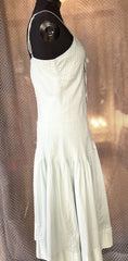 Essentiel Turquoise Summer Dress in 100% cotton, featuring a classic cut and flared skirt for casual comfort and style.