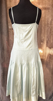 Back view of Essentiel Turquoise Summer Dress made of 100% cotton, featuring a classic cut and soft fabric.