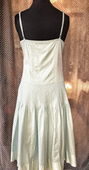 Back view of Essentiel Turquoise Summer Dress made of 100% cotton, featuring a classic cut and soft fabric.