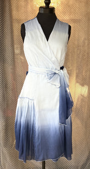 Marccain blue silk dress featuring a flattering wrap design and gradient ocean-inspired color for summer elegance.