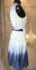 Side view of Marccain blue silk dress featuring gradient blue color and wrap design, ideal for summer elegance.