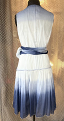 Back view of Marccain blue silk dress featuring gradient blue color and flattering wrap design.