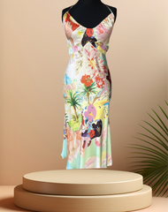 Colorful Gerard Darel silk floral dress displayed on a mannequin with tropical prints and a flattering cut.