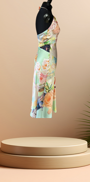 Gerard Darel silk floral dress displayed on a mannequin against a soft background, showcasing elegant floral patterns.