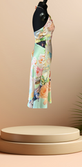 Gerard Darel silk floral dress displayed on a mannequin against a soft background, showcasing elegant floral patterns.