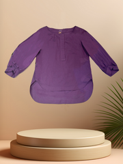 Marccain purple blouse, crafted from high-quality cotton, featuring a stylish longer back for enhanced silhouette.