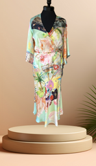 Gerard Darel silk floral dress featuring vibrant colors and a flattering wrap design, perfect for any elegant occasion.